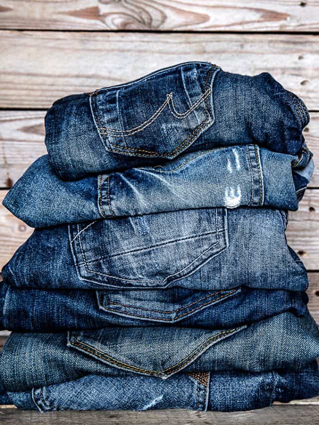 Jeans stacked on a wooden