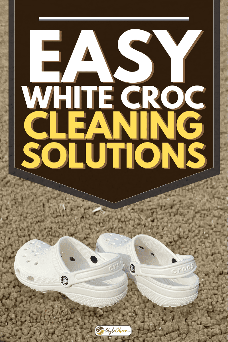 A pair of white Crocs footwear on a sandy beach, Easy White Croc Cleaning Solutions