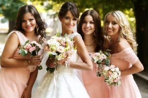 Bride with bridesmaids on the park on the wedding day, Bride And Bridesmaid Jewelry: To Match Or Not To Match