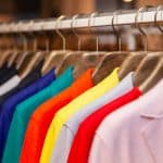 Different colors of coats hanged on a store, Science Reveals 'Enclothed Cognition' - The Psychology of What We Wear