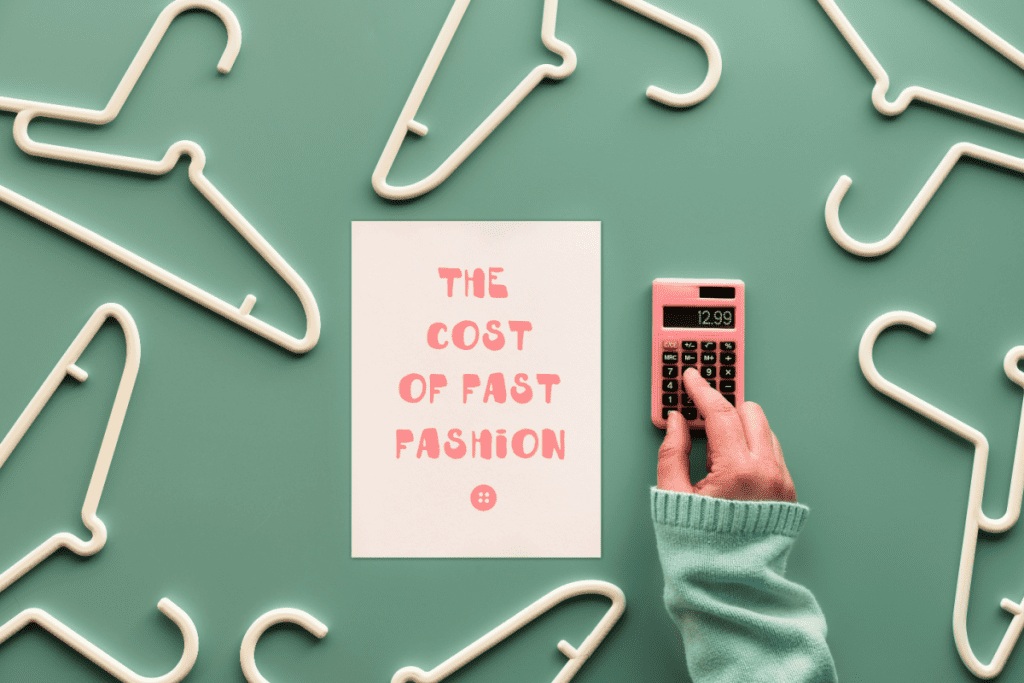 The cost of fast fashion. White plastic hangers, hand with calculator and paper with text. Creative flat lay on pastel green mint background.
