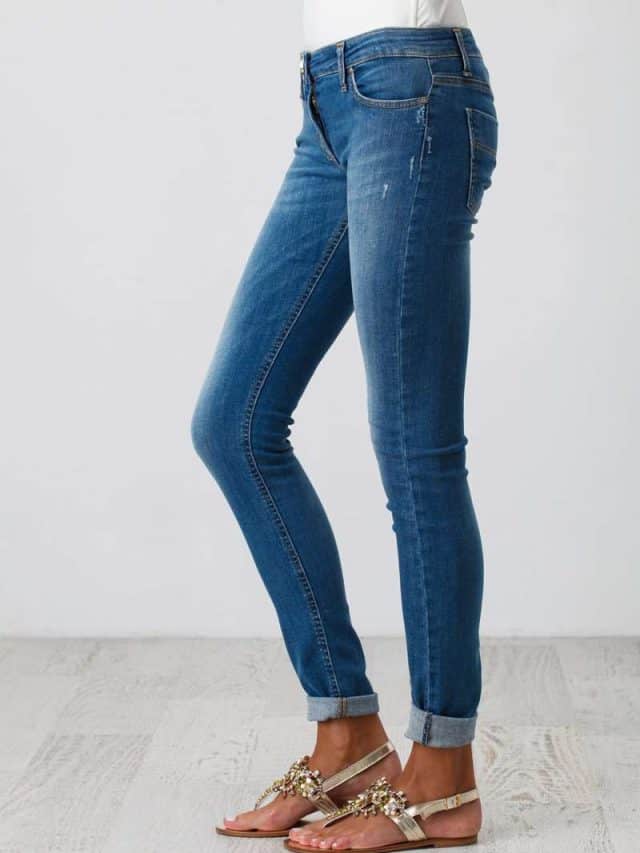 Woman,In,Blue,Skinny,Jeans,On,The,White,Background