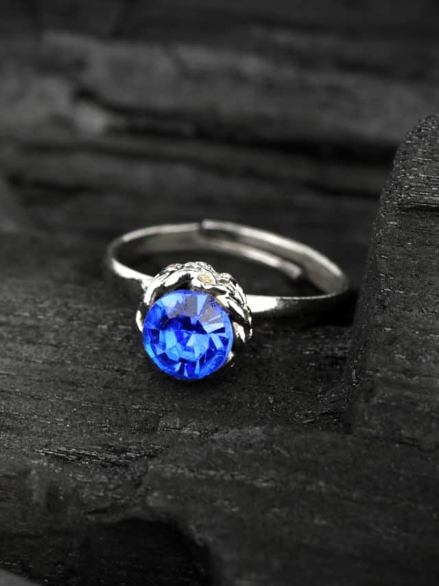 Jewellery,Ring,Witht,Blue,Sapphir,On,Dark,Coal,Background,,Soft