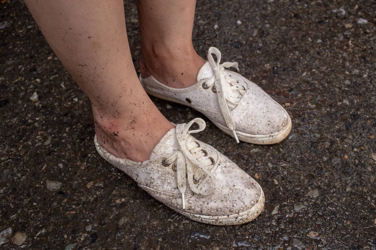 Woman wearing dirty white shoes