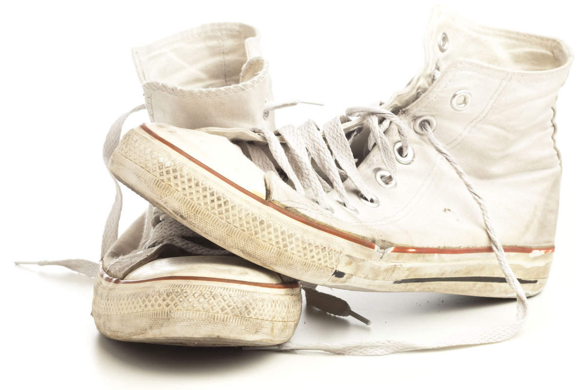 Yellowing white shoes on a white background
