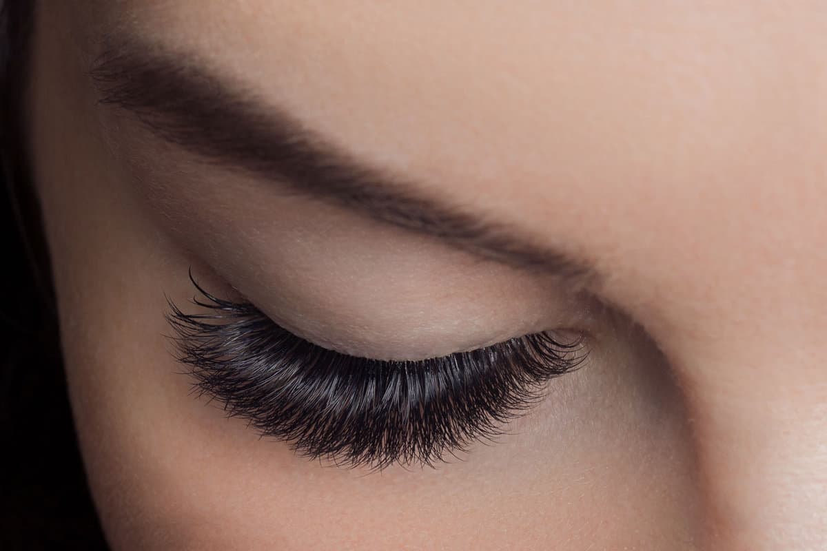 Up close photo of a woman's newly attached fake eyelash