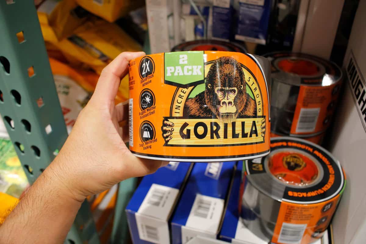 Man holding a box of Gorilla glue