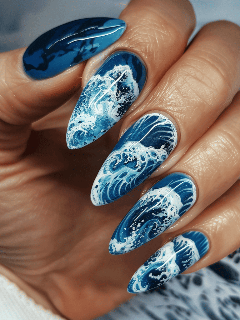nails with Capture ocean's waves with a deep blue and white design that mimics the foam and flow of the sea