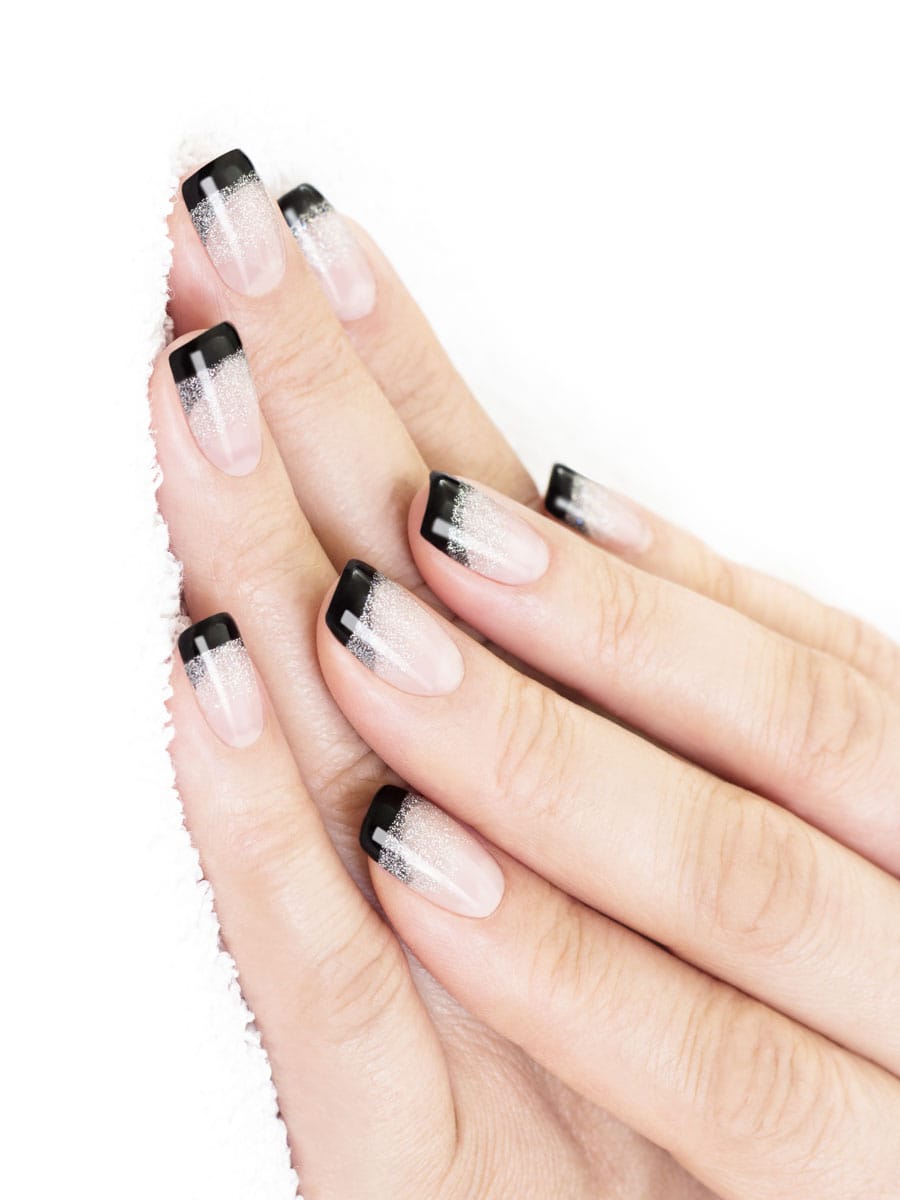 black and silver glitter French manicure on sheer base