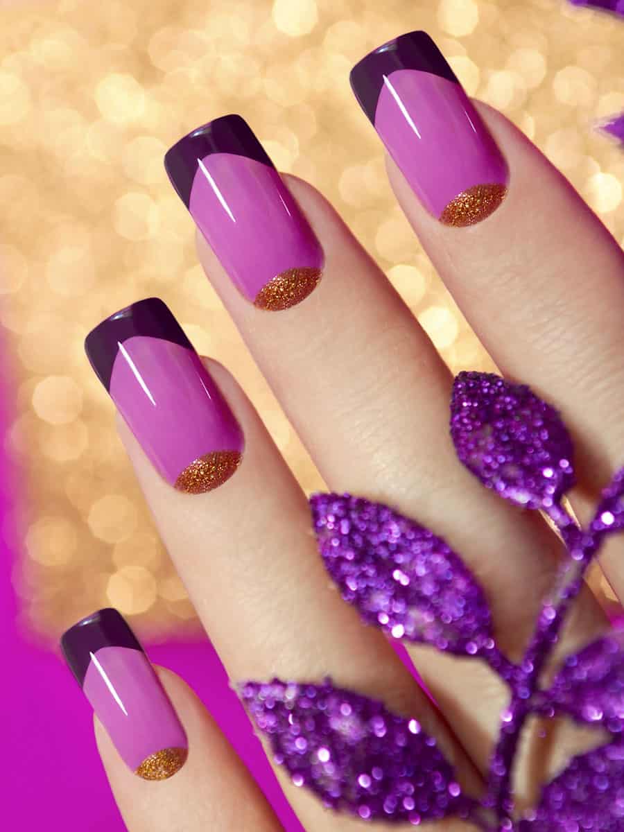 purple nails with plum tips and golden glitter half-moons