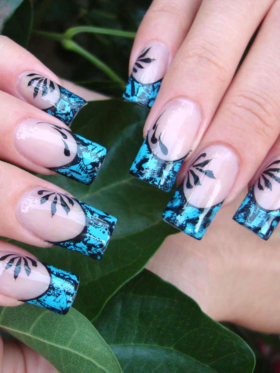 French manicure with blue crackle effect and black foliage design
