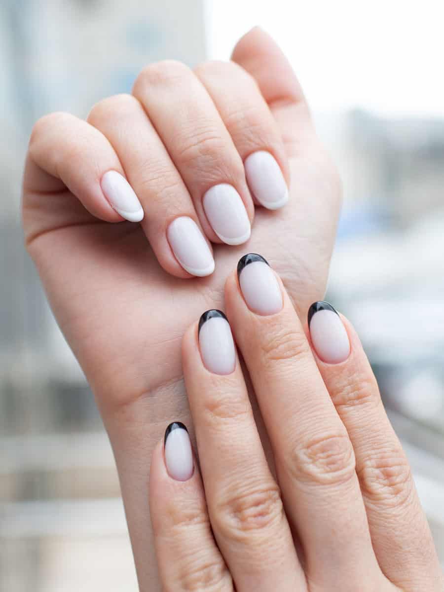 white nails with black French tips