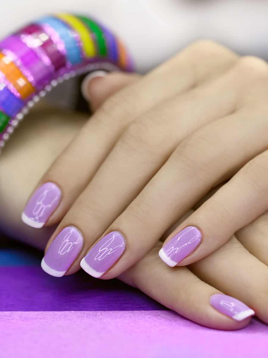 lilac nails with heartbeat design and white tips