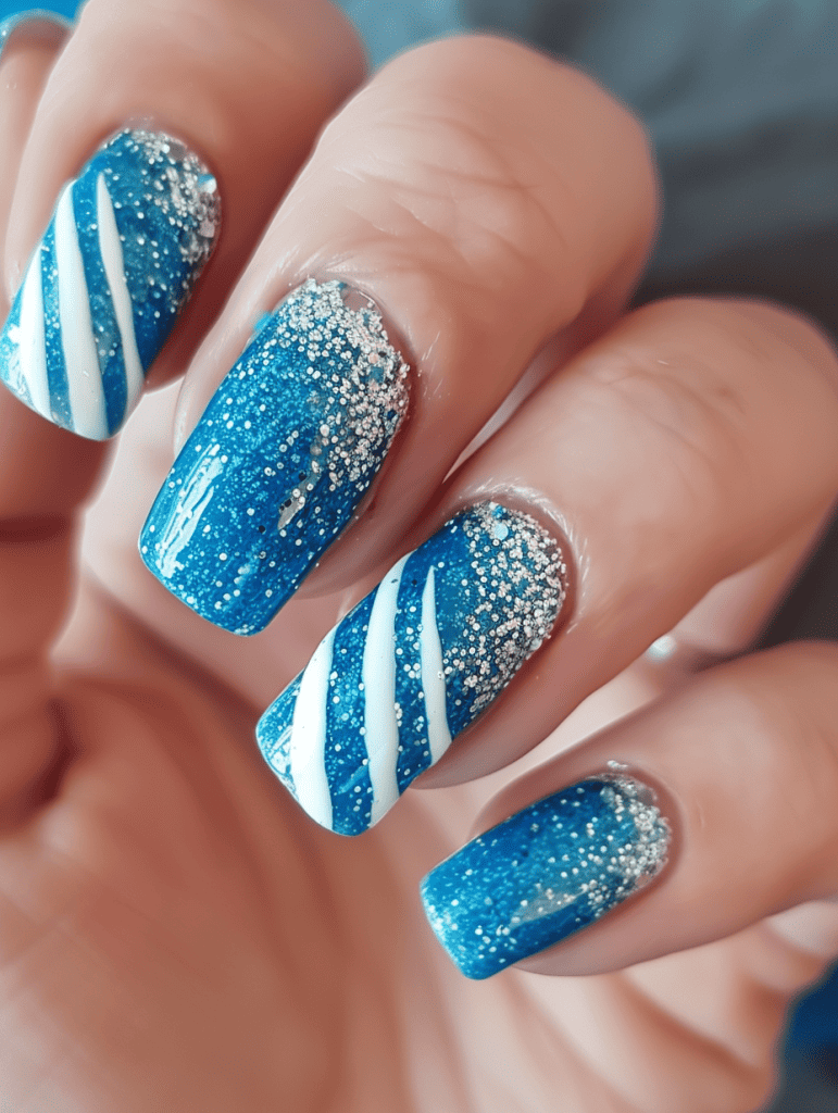 Glitter nail design with blue glitter and white stripes