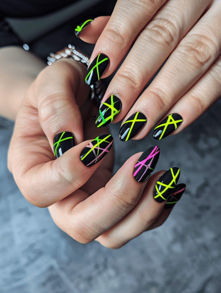 geometric nail art with neon lines on a dark base