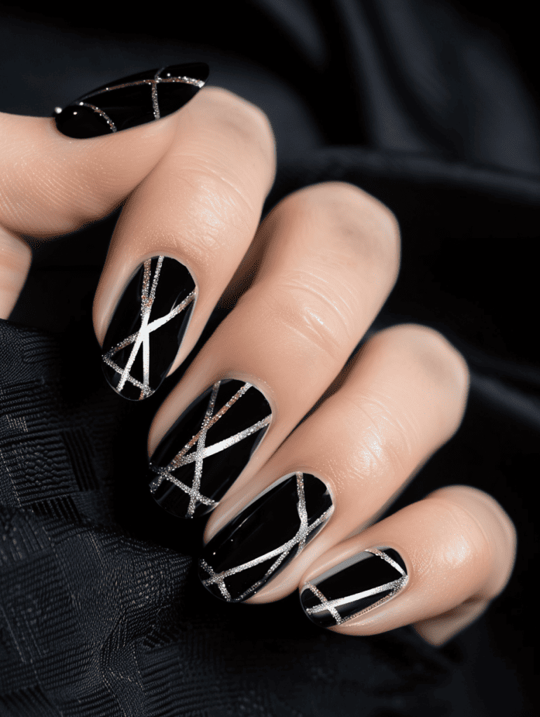 geometric nail art with silver geometric lines on black