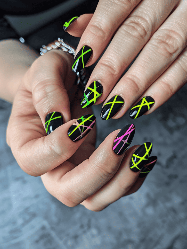 Stripe nail design with neon stripes on black nails