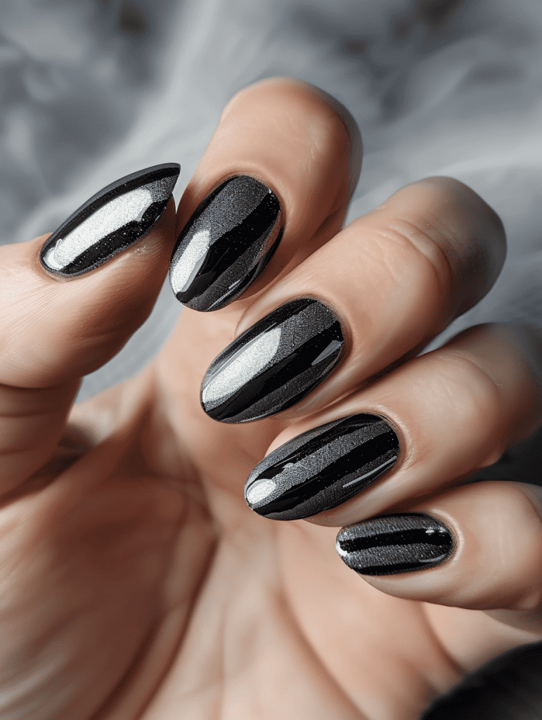 Stripe nail design with black holographic stripes on grey nails