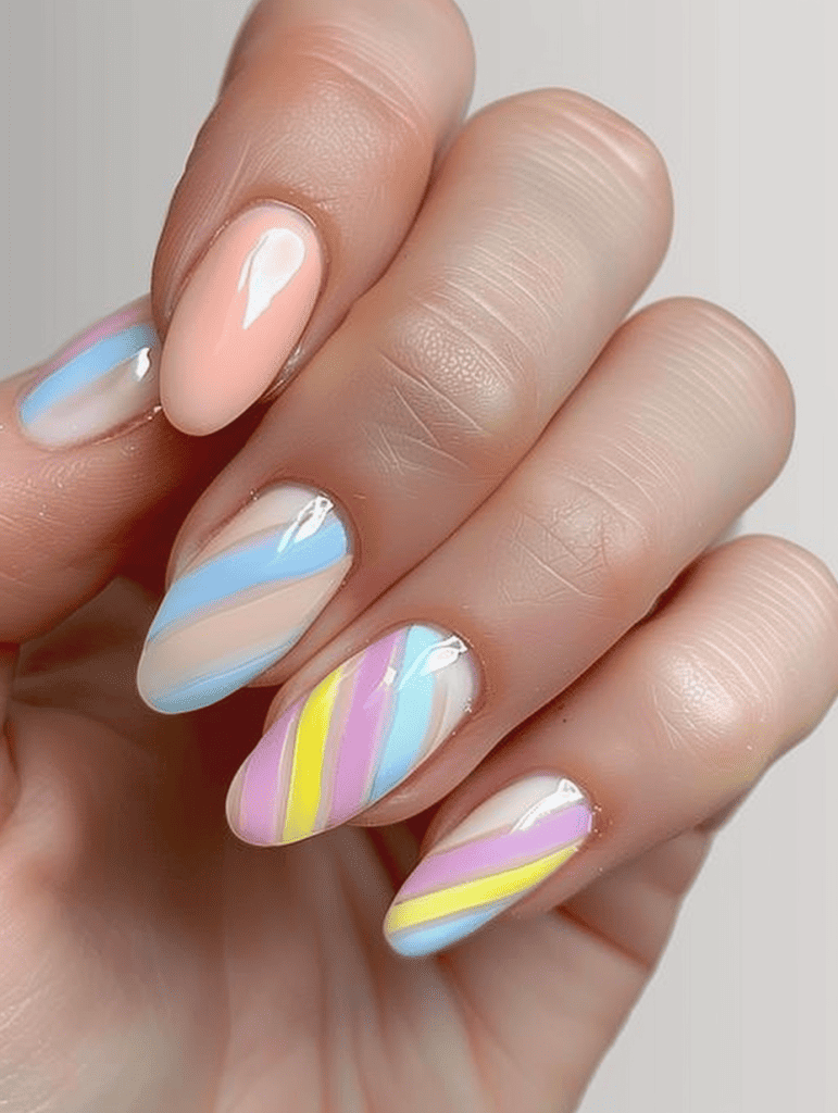 Stripe nail design with diagonal stripes in pastel colors