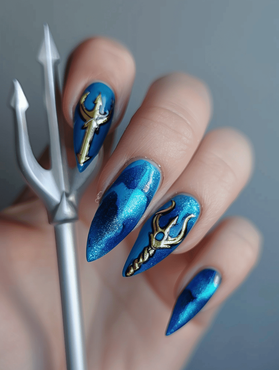 Superhero nail art design featuring Aquaman trident and ocean blues