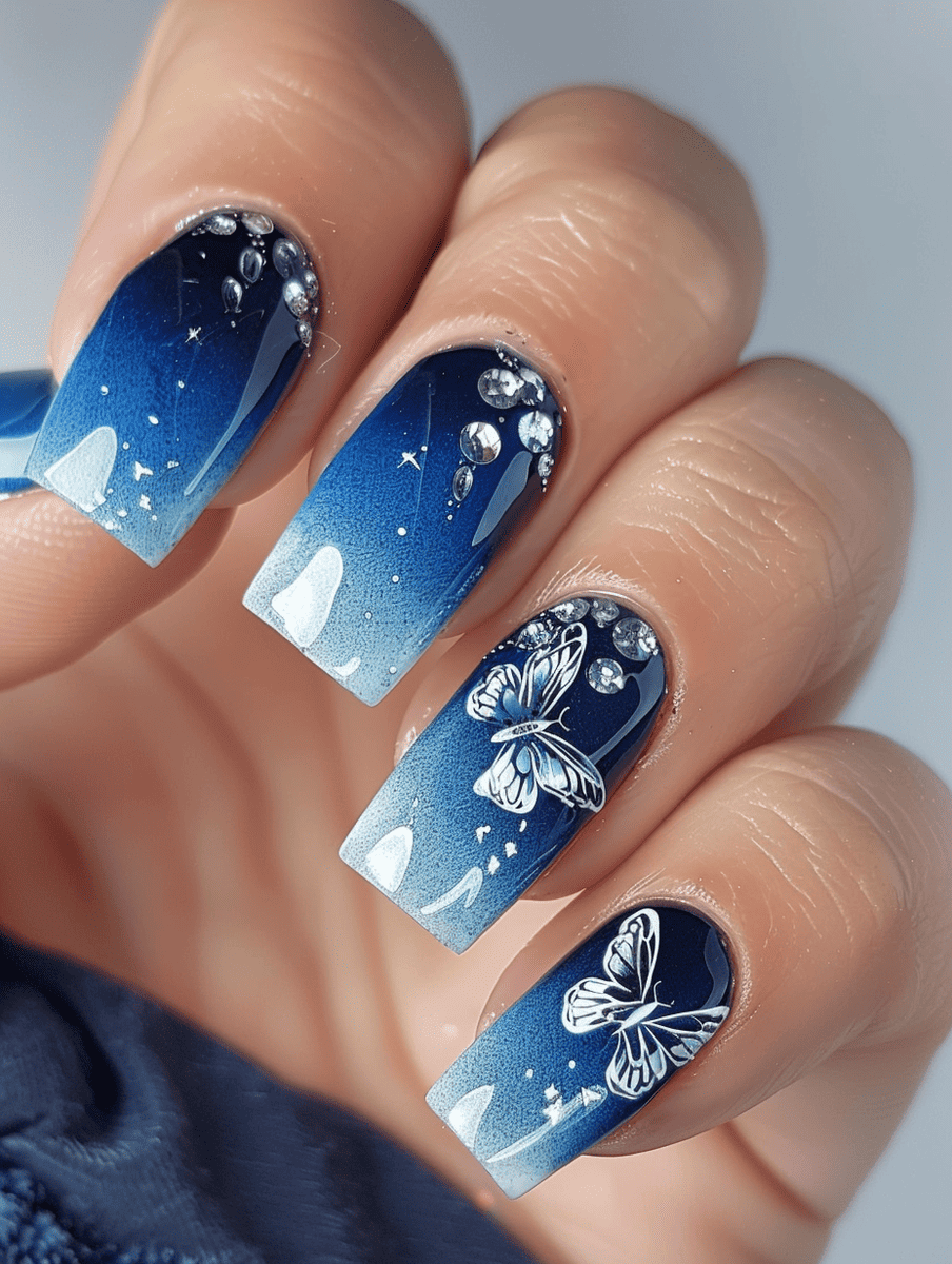 butterfly nail art with blue ombre and silver butterfly accents