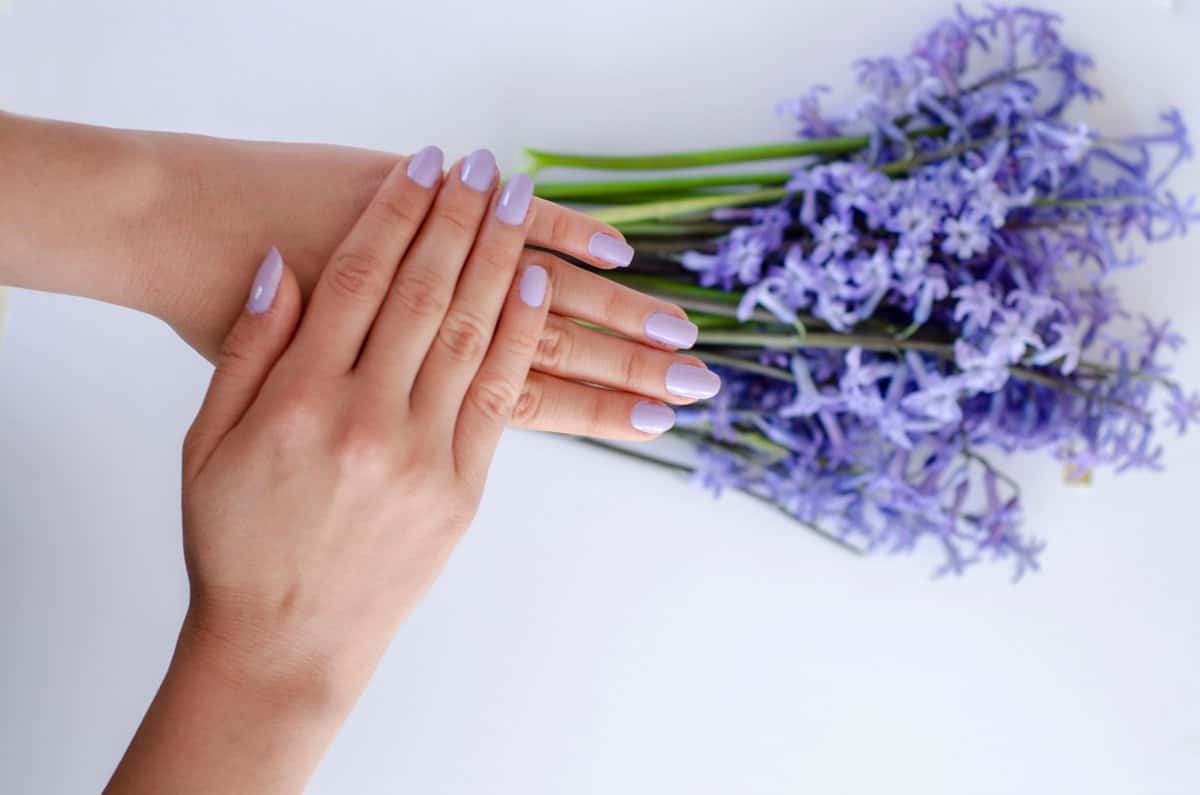  hands and vanished nails with purple flowers