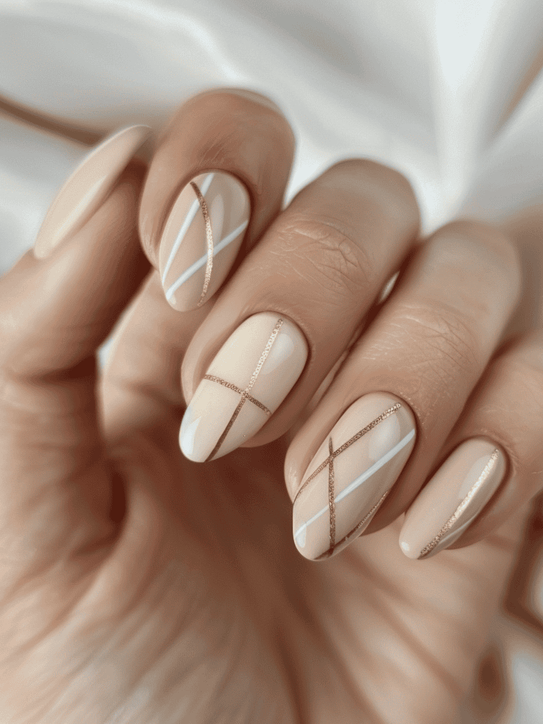 minimalist nail design with beige and thin diagonal stripes