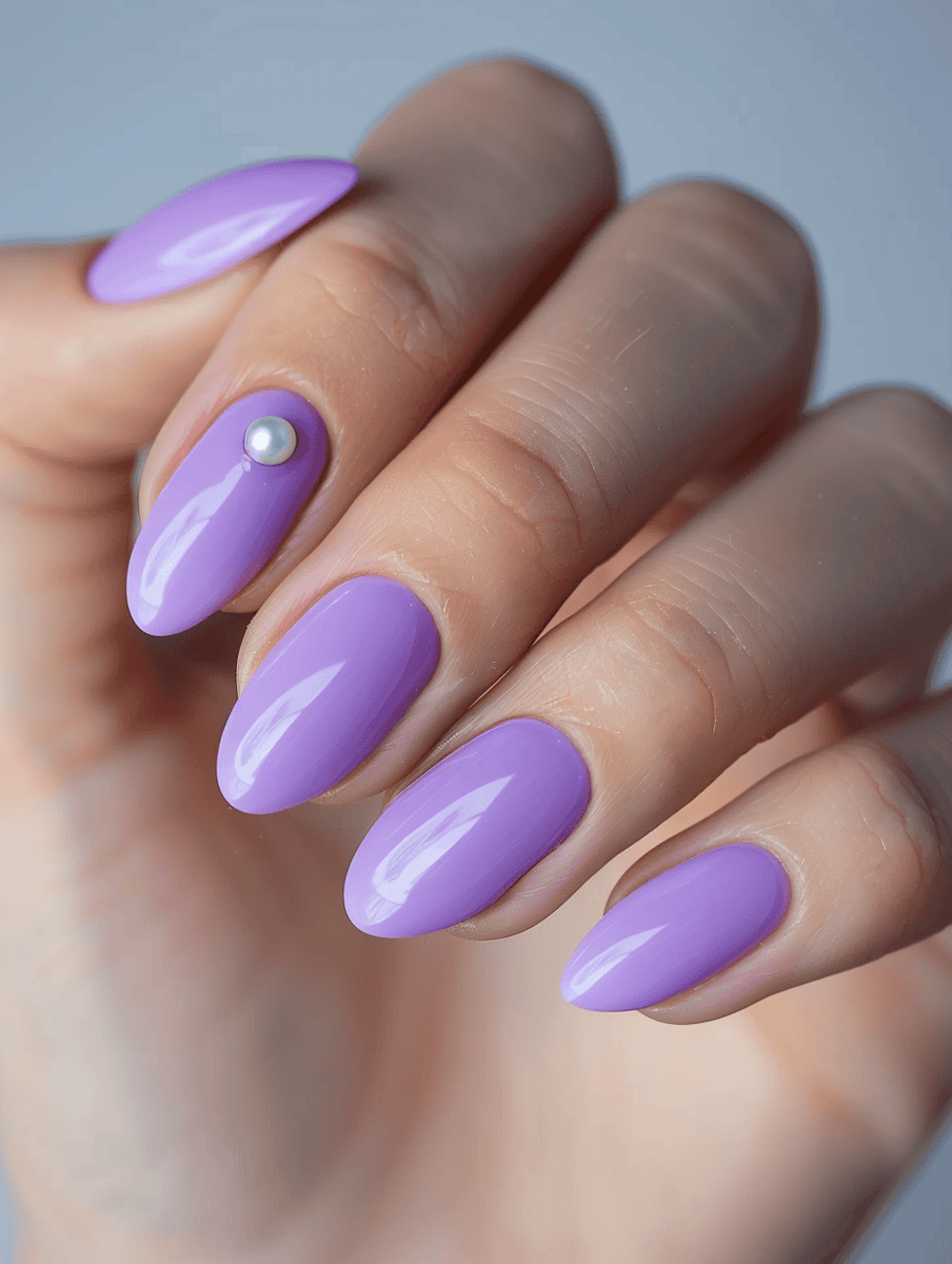 Purple round nails with a single pearl