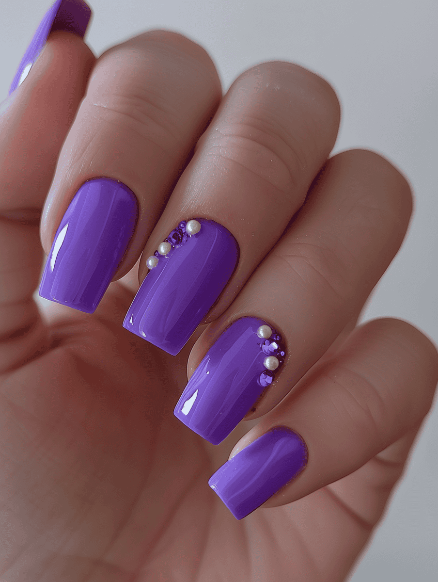 Purple square nails with pearl accents