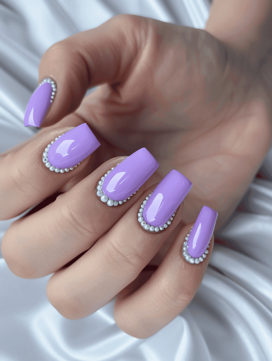 Purple square nails with pearl edging