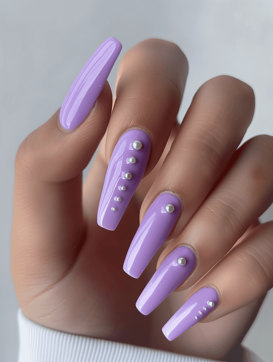 Purple long square nails with pearl drops