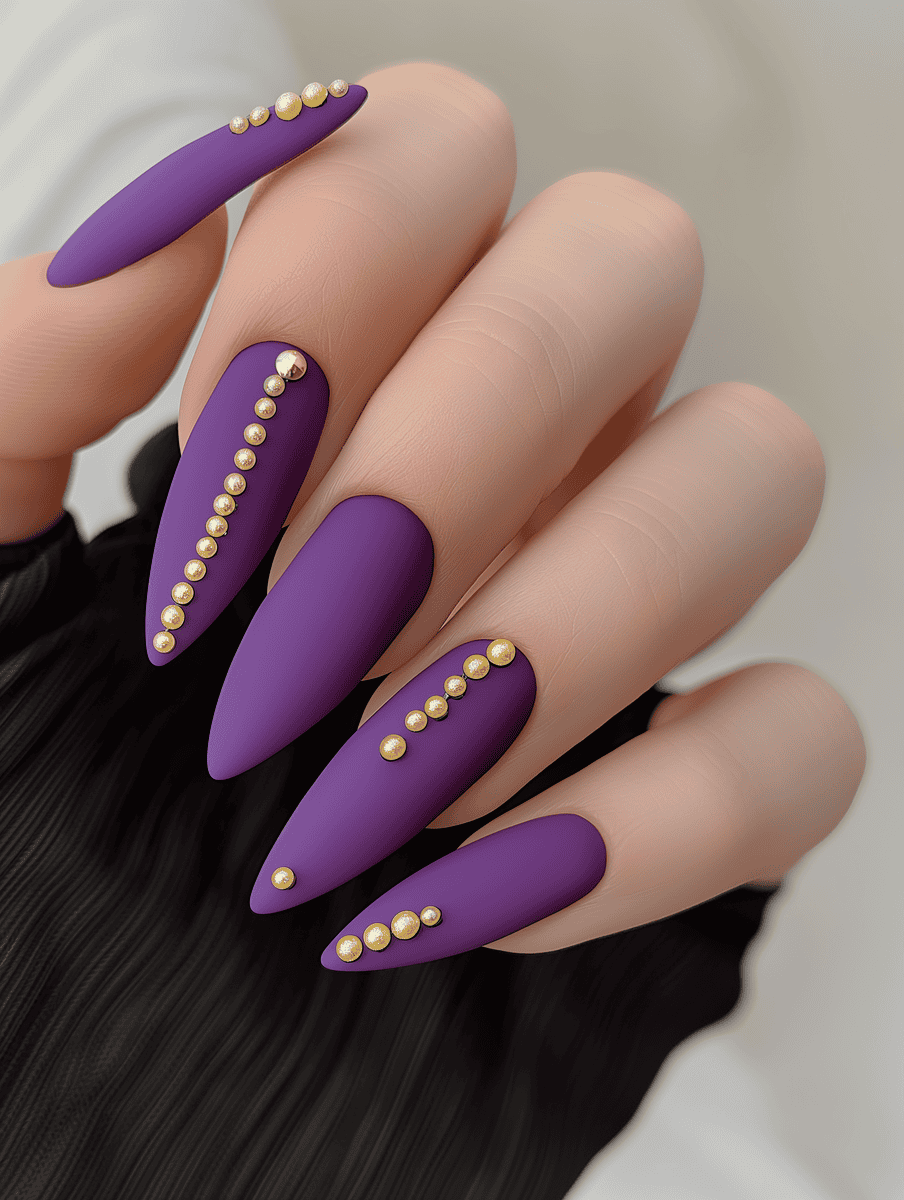 Purple stiletto nails with pearl clusters