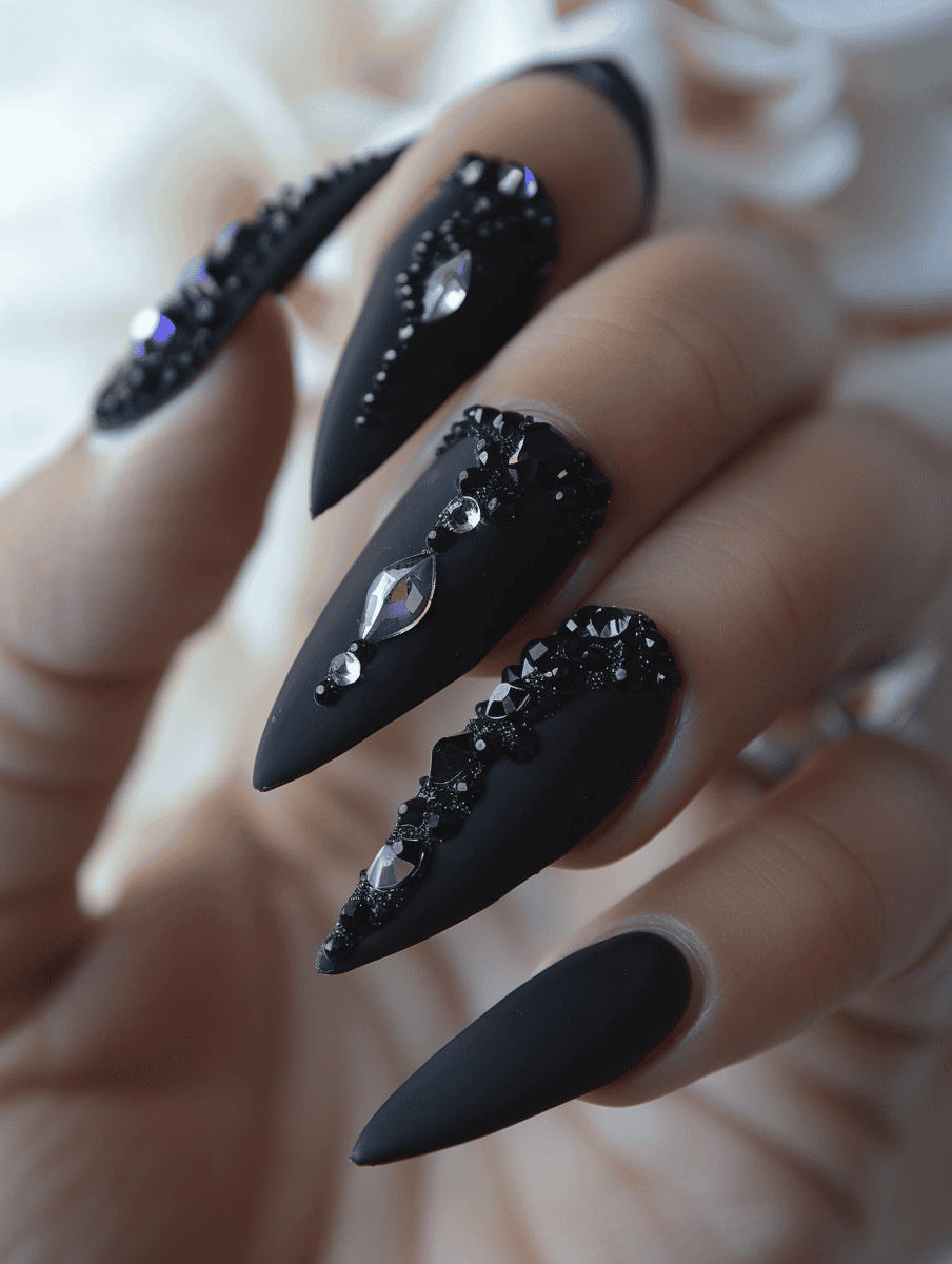 matte black nail design with crystal embellishments