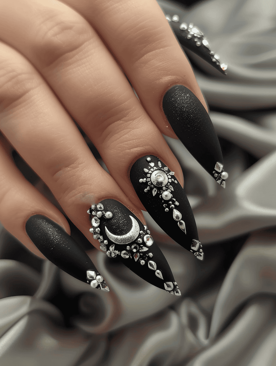 Black matte nails with silver sun and moon charms