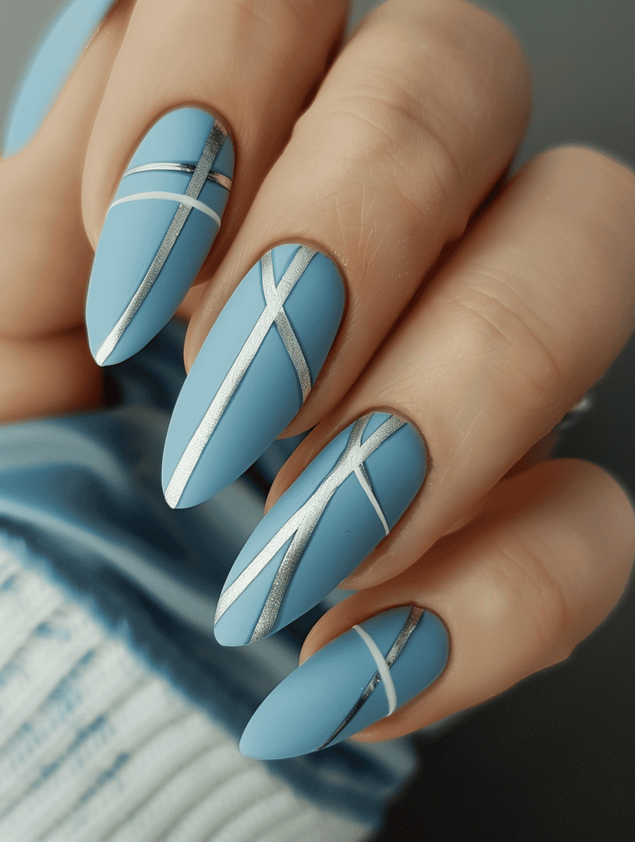 Light blue matte with silver lines winter nail design