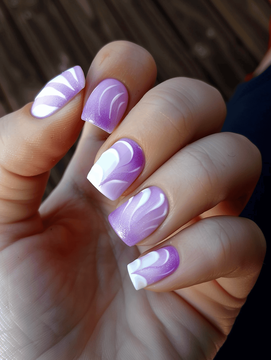 White and pastel color block nail design with pastel purple and white swirls