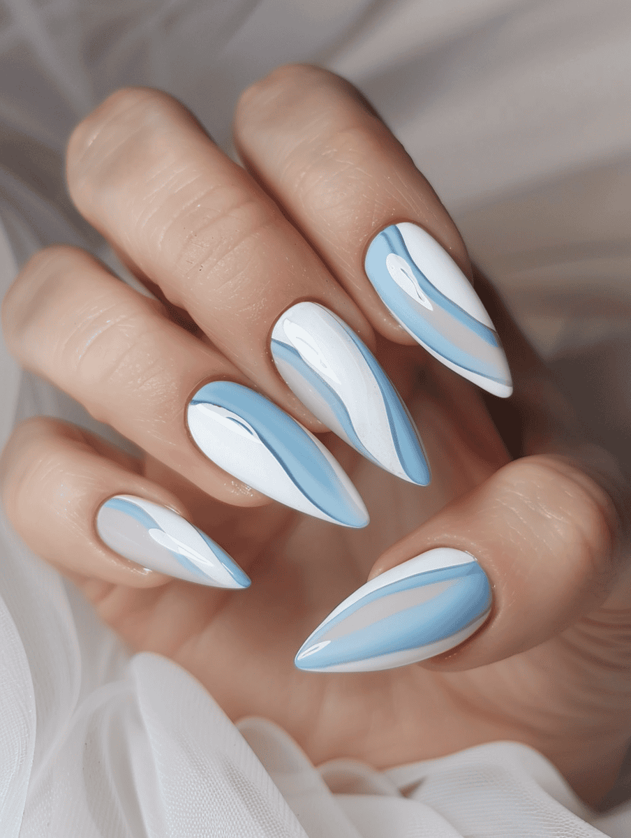 White and pastel color block nail design with white and pastel blue wavy lines