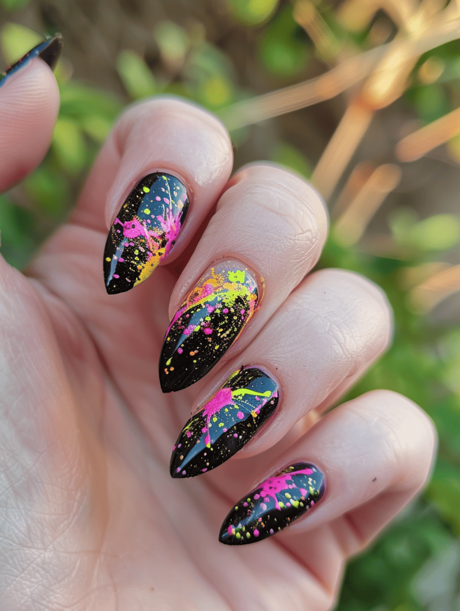 abstract nail art with neon splatter on matte black