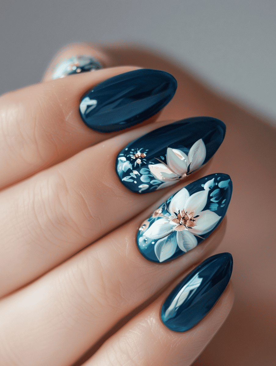 Prom nail inspiration with lotus flowers on deep blue nails