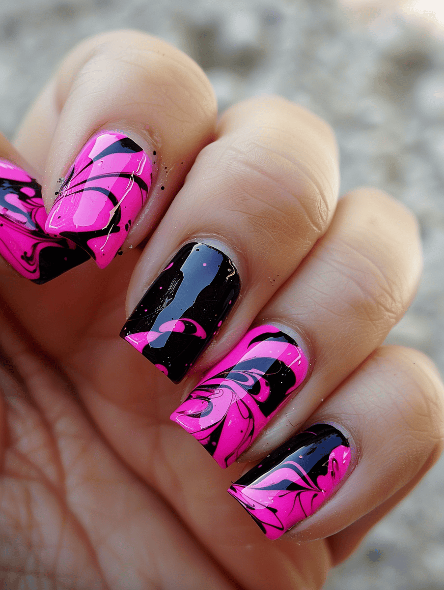 Hot pink and black nail art with hot pink nails with black marbling