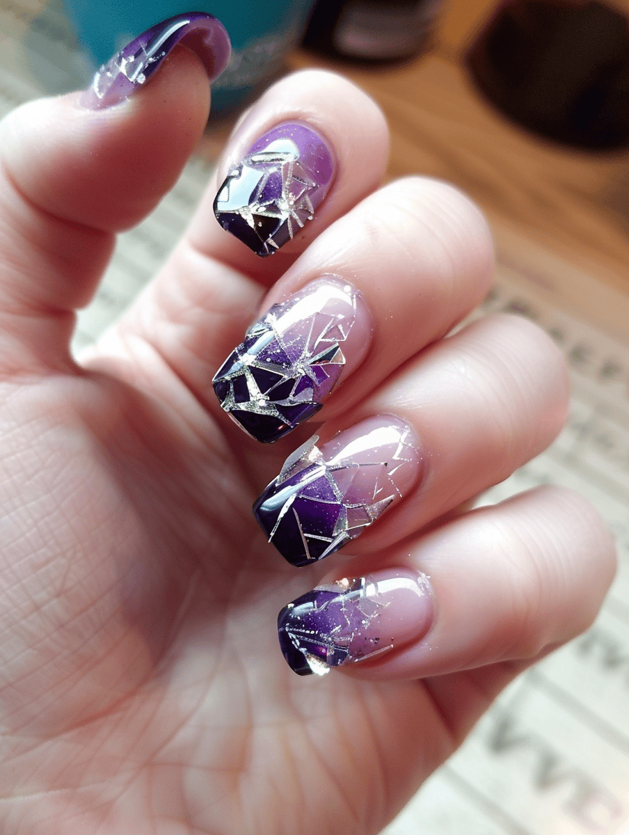 Shattered glass nail design with purple gradient and shiny clear shattered glass pieces