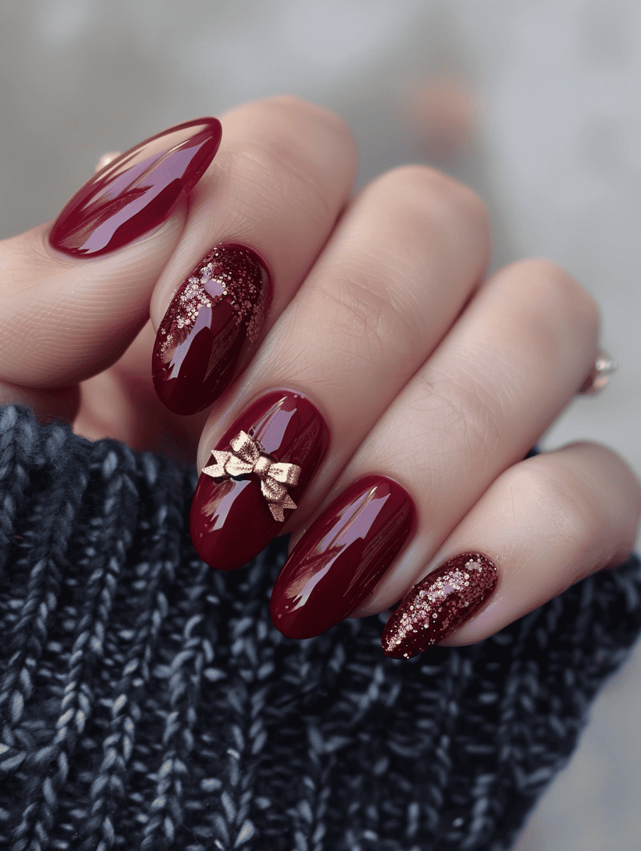 prom nail inspo. burgundy with golden bow