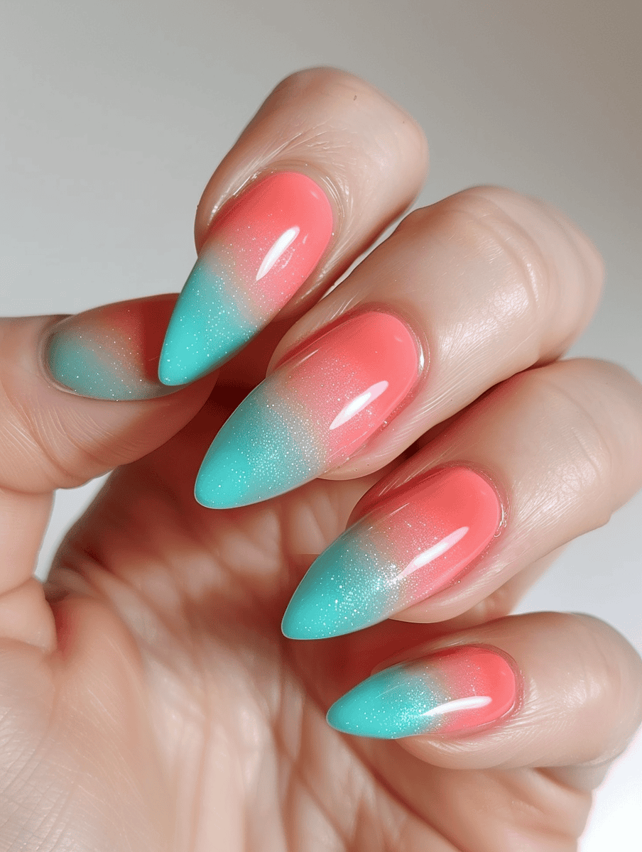 Teal and coral ombre nail design for a seamless color transition that's stylishly soothing