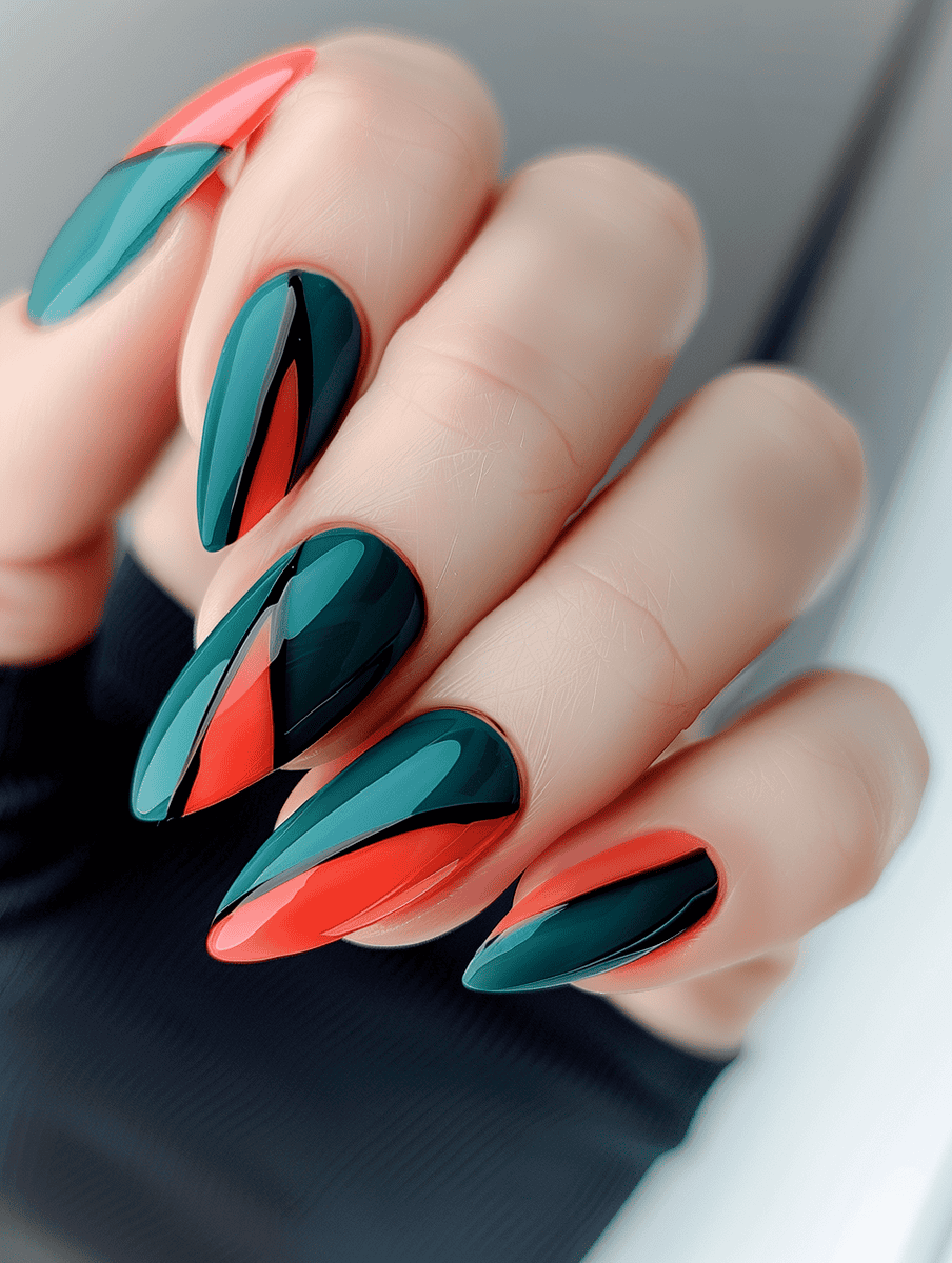 Abstract geometric nail art in teal and coral with black outline accents