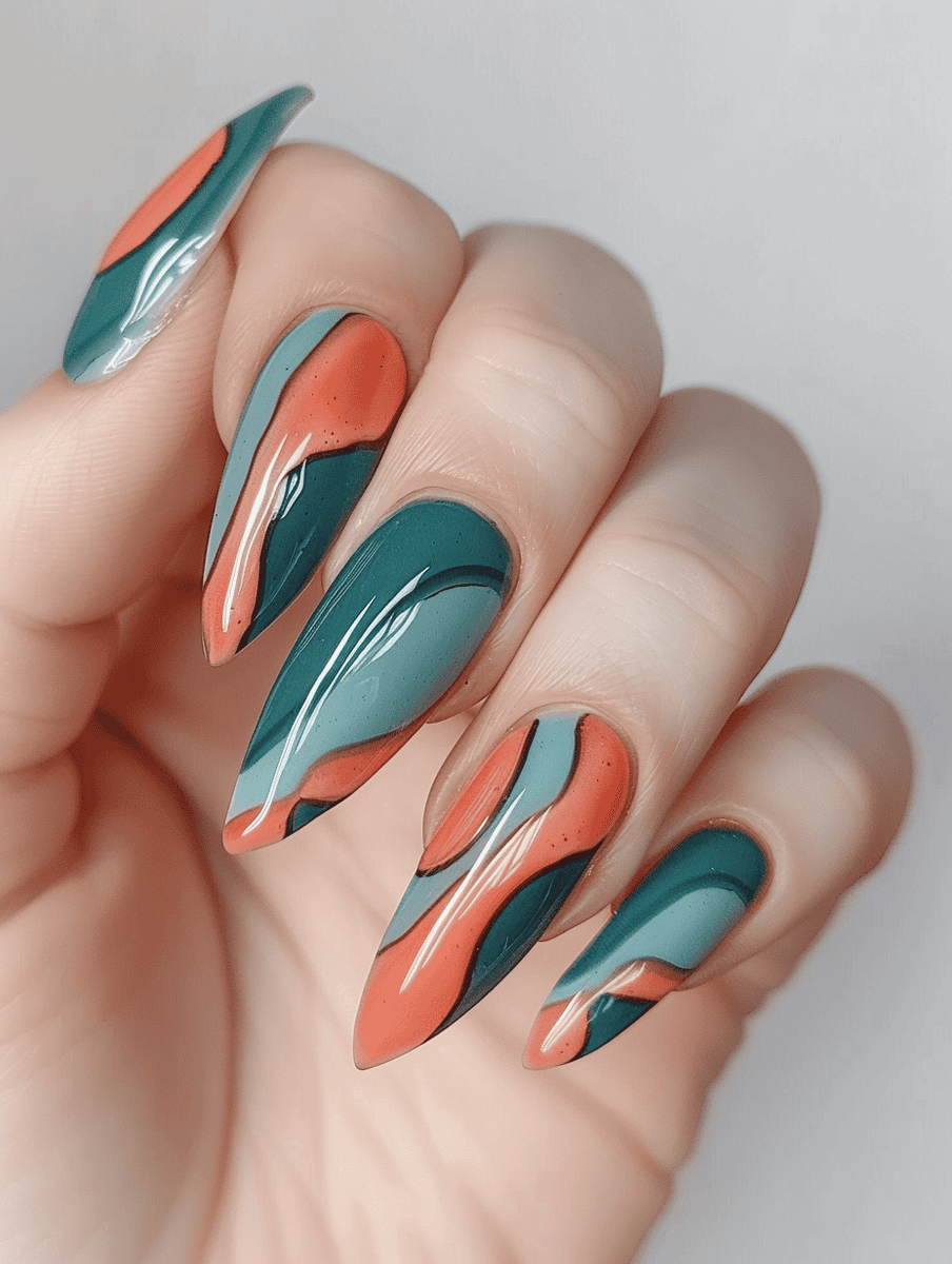 Teal and coral wave pattern nail design for a fluid, rhythmic aesthetic