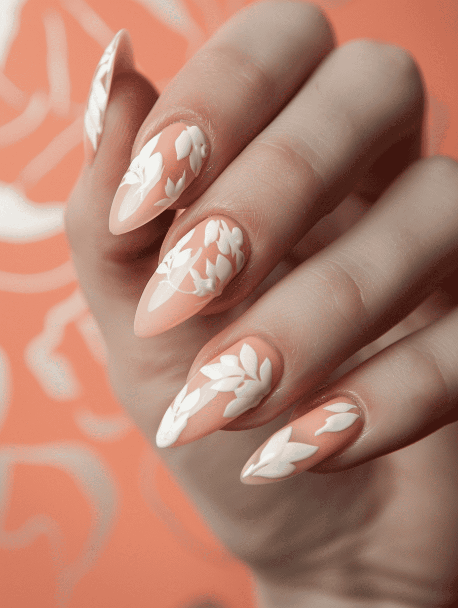 Peach nails with cream leaf designs