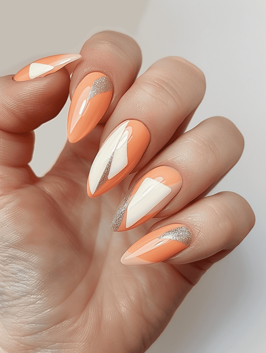 Peach nails with cream accents and glitter detail